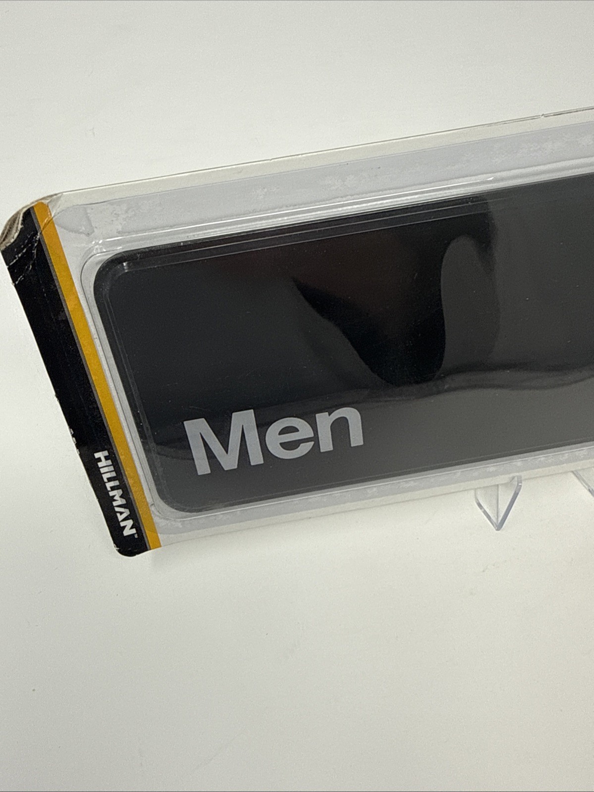 Hillman 841750 Men’s Restroom Sign 3″x9″ Plastic Men Symbol Bathroom Black/White