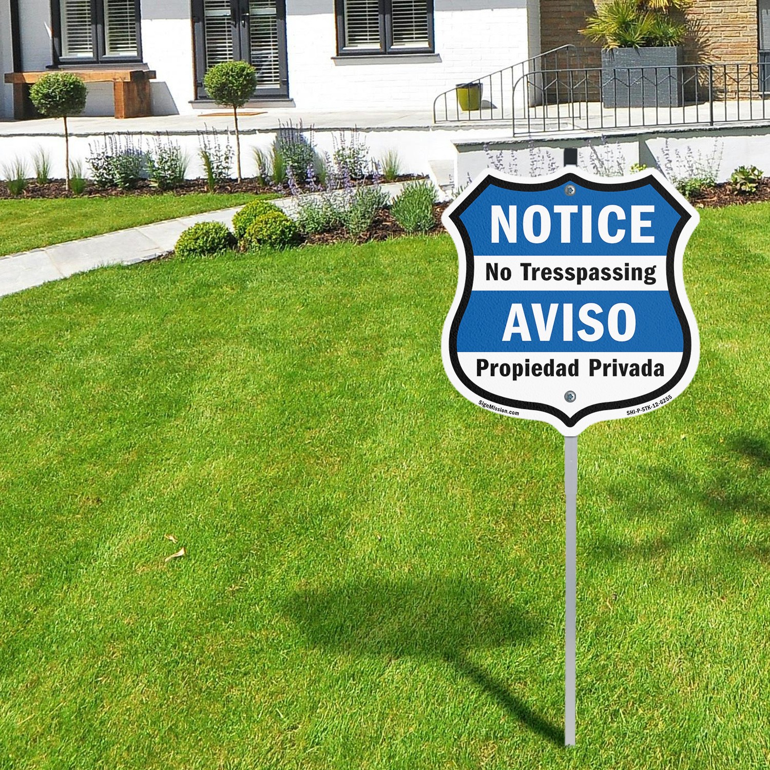 Notice No Trespassing Bilingual English / Spanish Shield Shaped Sign With Stake
