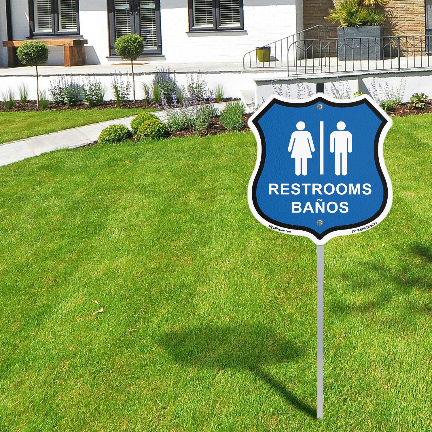 Restrooms Ba�os Bilingual English / Spanish Shiel Shaped Sign With Stake