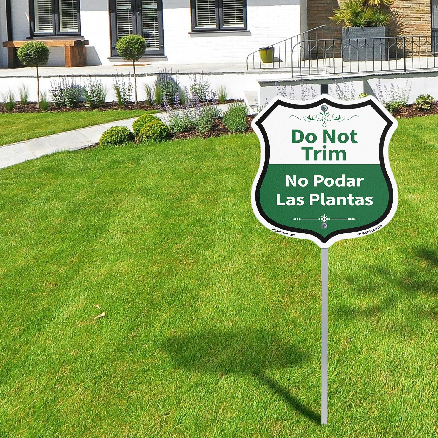 Do Not Trim Bilingual English / Spanish Shield Shaped Sign With Stake