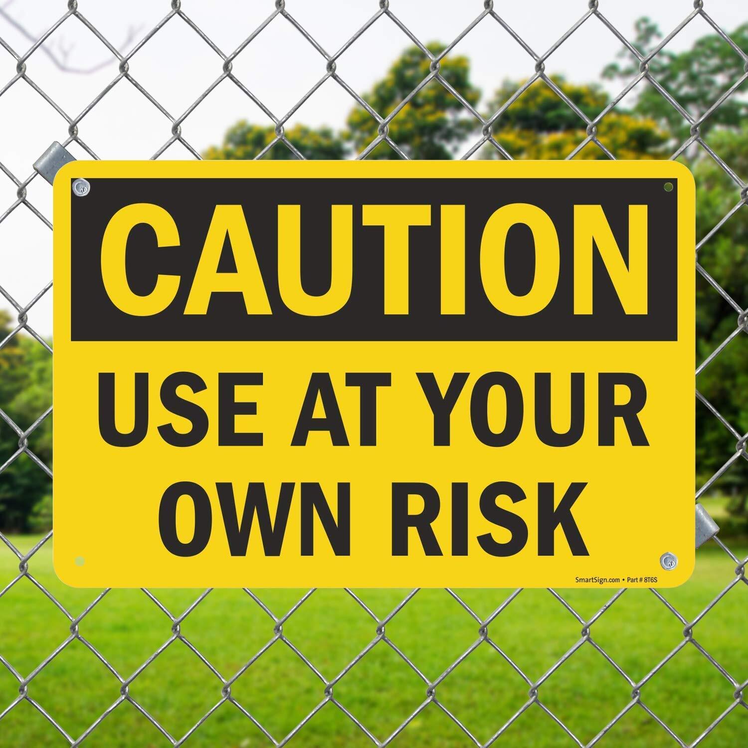 12 x 18 inch “Caution – Use at Your Own Risk” Metal Sign with Pre-cleared hol…