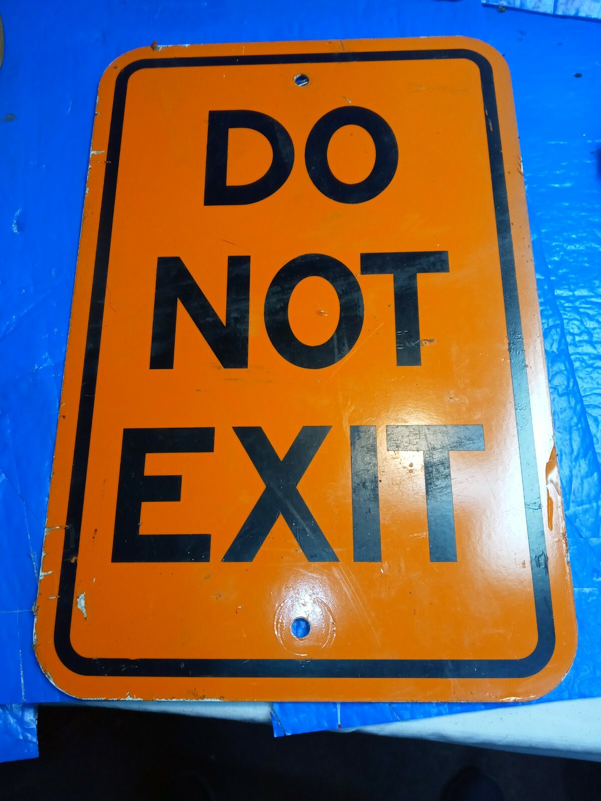 DO NOT EXIT SIGN 12X18 INCHES ORANGE ALUMINUM USED READY FOR SERVICE.